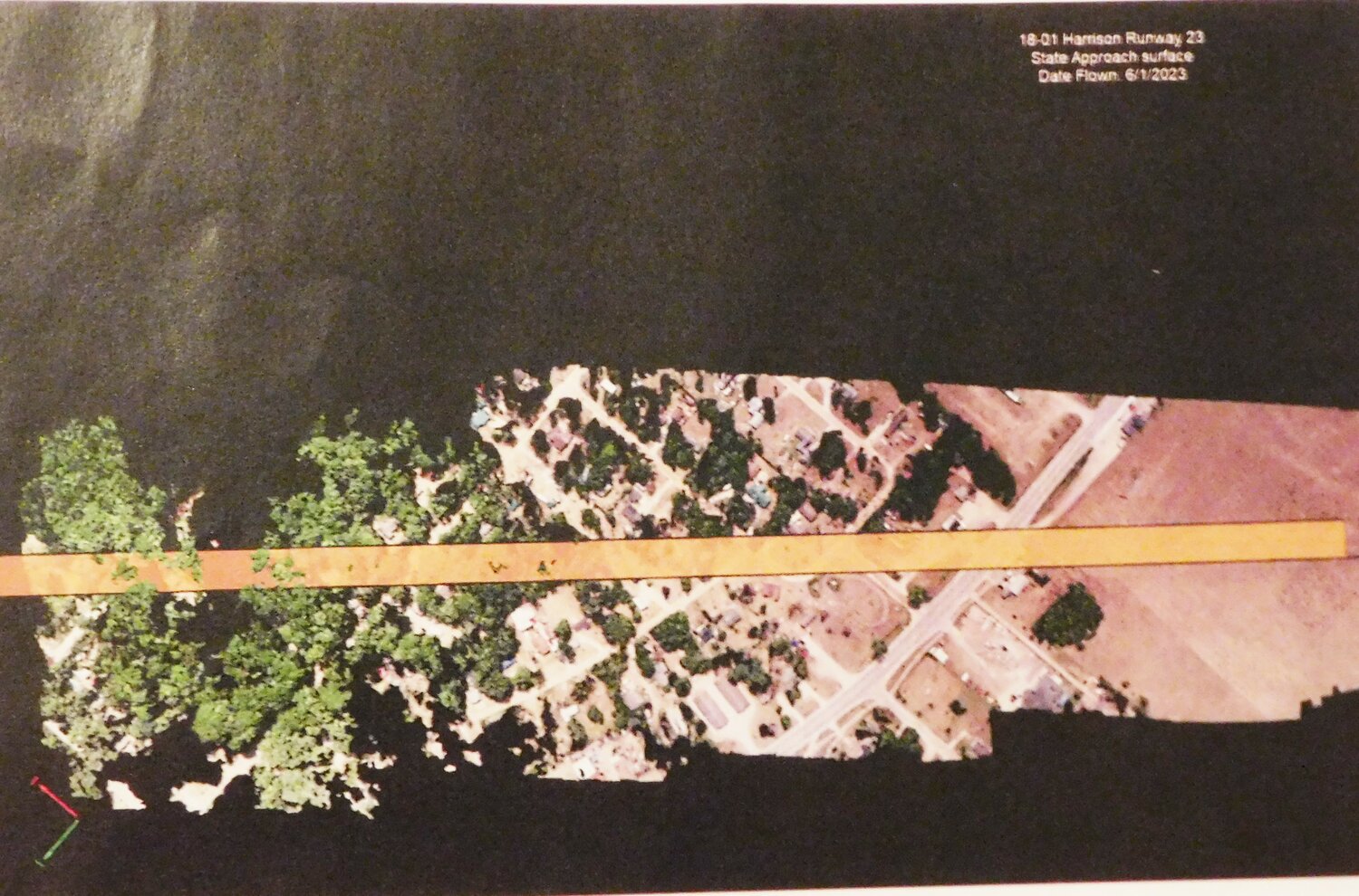 These drone Runway 23 photos with color overlays show the difference between what the state allows for runway approach clearances (gold) and the lower federal height limitations (red). The encroaching trees are vastly different between the two